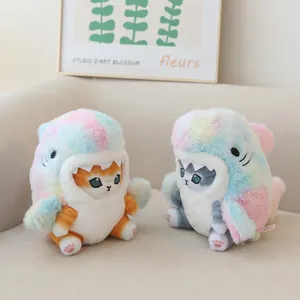 Detailed view of two cute colorful rainbow shark cat plush toys in a cozy home setting