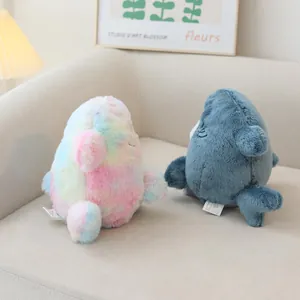 Macro view showing the back texture of rainbow and blue shark cat hybrid plush toys