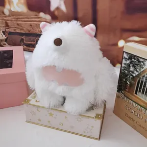 Close-up of white fluffy long-haired monster plush toy in a cozy gift setting