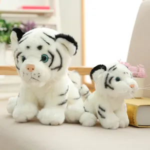 Two cute white tiger plush toys for children in a cozy setting, ideal as gifts
