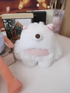 Macro detail of a white long-haired monster plush toy featuring cute pink striped ears