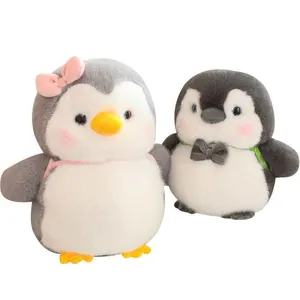 Pair of cute penguin plush toys with a pink bow and grey bowtie for children's gift