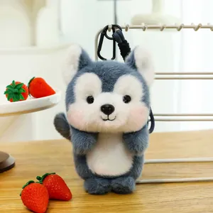 Detailed view of cute grey and white wolf plush toy on wooden table