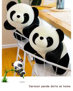 Close-up view of cute panda plush dolls placed on a chair in a warm home setting.