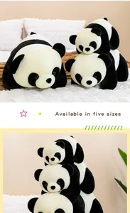 Detail view of multiple sizes of cute panda plush toys stacked in a cozy home setting