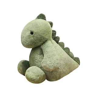 Adorable soft green dinosaur plush toy sitting in a cute relaxed pose on white