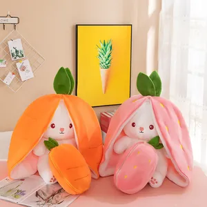 Cute strawberry and carrot reversible rabbit plush toys displayed in a warm home setting