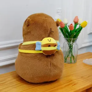 Rear detail of a soft capybara plush toy featuring a cute bee backpack accessory