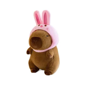 Adorable capybara plush doll wearing a pink rabbit hat, soft toy for kids gifts