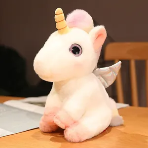 Weiches weißes Einhorn-Stofftier mit irisierenden Flügeln und goldenem Spiralhorn