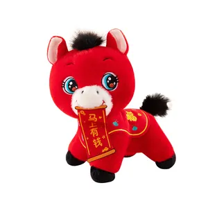 Red 2026 Year of the Horse plush mascot toy with a traditional blessing scroll