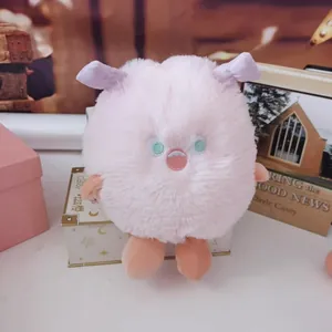 Adorable pink long-haired monster plush toy, soft fluffy stuffed animal for kids.