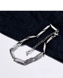Macro view of minimalist titanium steel bamboo joint link bracelet with extender chain