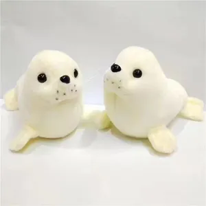 Adorable pair of soft white plush seal toys for nursery decor and kids gift idea