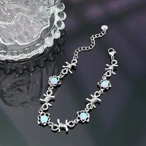 Detailed view of hip hop style barbed wire choker featuring iridescent moonstone beads