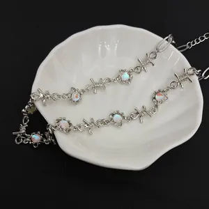 Hip hop style silver barbed wire necklace with iridescent faux moonstone accents