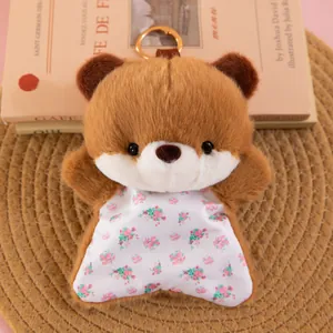 Close-up detail of a cute brown plush bear bean bag toy with floral pattern body