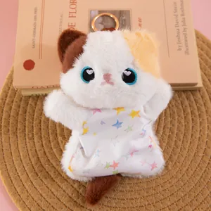 Close-up of a cute calico cat plush beanbag toy wearing a colorful star-print outfit.