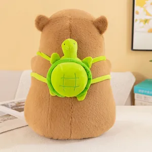 Adorable brown capybara plush toy featuring a green turtle shell backpack accessory