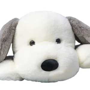 Adorable white plush puppy pillow in a cute lying position for bedroom home decor
