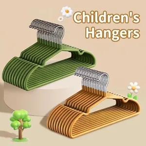 Non-slip children's hangers in green and orange with metal hooks on display