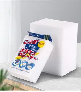 Detailed view of white nano melamine sponges in retail packaging and stacked blocks.