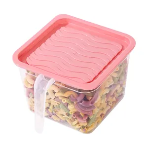 Clear plastic refrigerator food storage container with pink lid and handle.