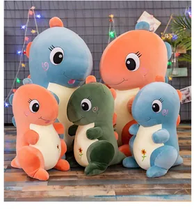 Grupo de adorables peluches de dinosaurio suaves en colores vibrantes azul naranja y verde