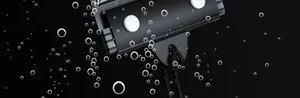 Macro view of black waterproof phone pouch sealing mechanism with bubbles