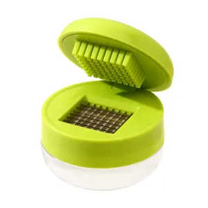 Professional manual garlic press and chopper with stainless steel blades in green open view