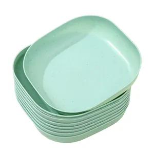 Stack of eco-friendly mint green square plastic bone spit plates for dining table use