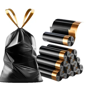 Durable black drawstring trash bags with gold handles, heavy-duty rolls for home kitchen use