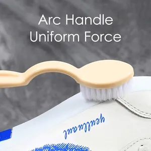 Ergonomic cream shoe washing brush with soft white bristles for gentle cleaning of sneakers