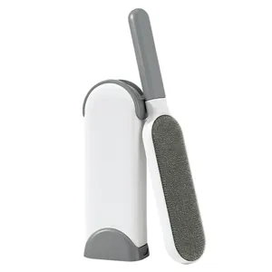 Double-sided reusable pet hair and lint remover brush with self-cleaning storage base
