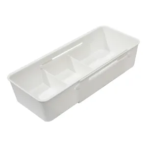 White expandable drawer organizer with dividers for kitchen cutlery and utensil storage