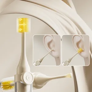 Portable dual-head ear and nose cleaning tool set with silicone brush and ear spoon.