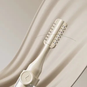 Dual-ended ear and nose cleaning tool with rotating scraper for safe hair removal.