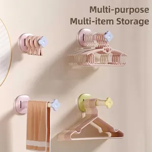 Multipurpose wall-mounted drying rack for hangers, clips, and towels in pastel colors