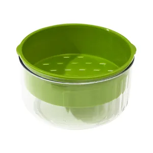 Double-layer vegetable washing basin with green colander and clear plastic outer bowl