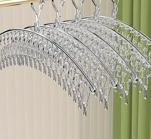 Detailed macro view of silver stainless steel arched sock drying rack with multi-clip system