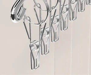 Macro view of durable stainless steel spring clips on a laundry drying rack for socks