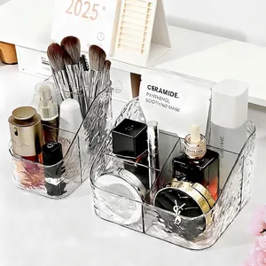 Transparante acryl make-up organizer voor cosmetica, kwasten en huidverzorging op bureau