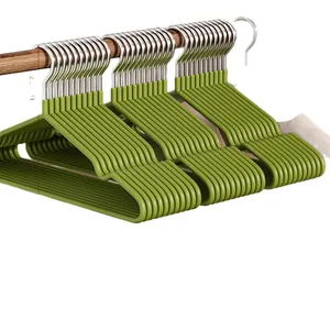 Set of durable green non-slip plastic hangers with sturdy metal hooks for home clothing.