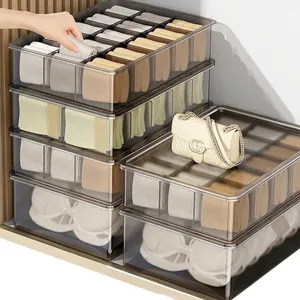 Transparent stackable storage boxes for underwear and socks shown in a home setting