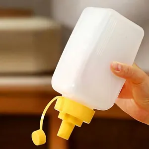 Flexible transparent squeeze condiment bottle with yellow lid and measurement scales