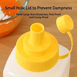 Yellow squeeze bottle seasoning dispenser with small hole lid for moisture protection