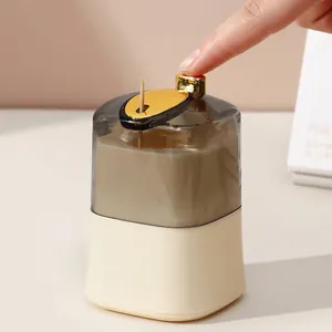 Automatic press-type toothpick dispenser with transparent cover and gold button