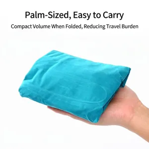 Almohada lumbar inflable portátil de viaje plegada al tamaño de la palma