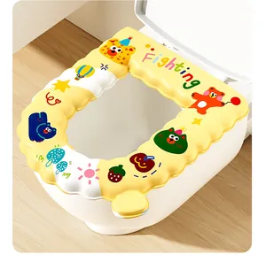 Detail view of a cute yellow waterproof toilet seat cover featuring bear and fruit patterns