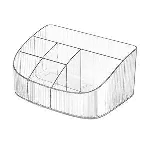 Clear acrylic makeup organizer with ribbed texture and multiple compartments for storage